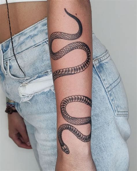 snake wrapped tattoo